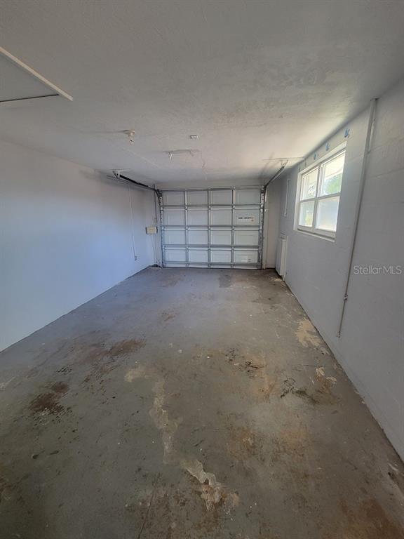 10225 Gardenia Lane Port Richey, FL 34668 - Photo 15 of 17 an empty room with windows