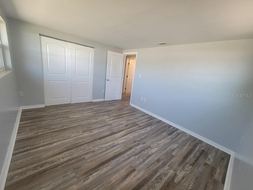 10225 Gardenia Lane Port Richey, FL 34668 - Photo 8 of 17 a view of room with wooden floor