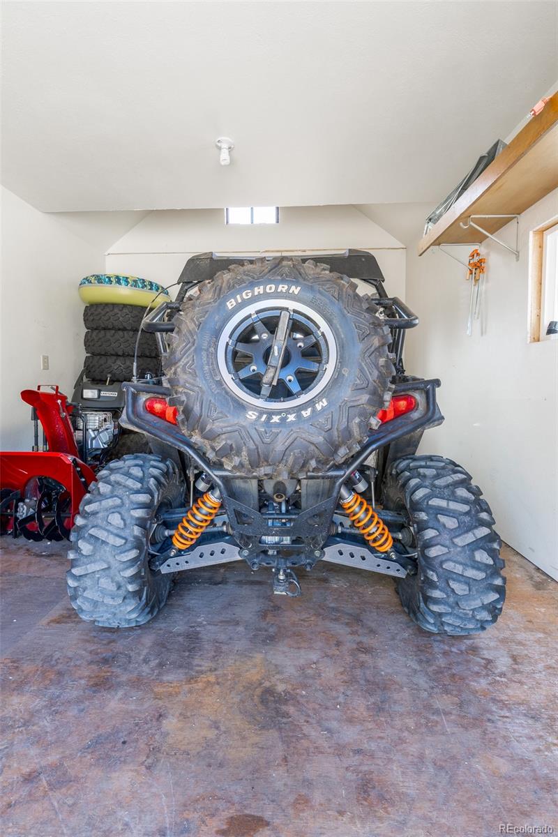 8221 Remington Road Como, CO 80432 - Photo 44 of 49 a view of gym equipment and a garage