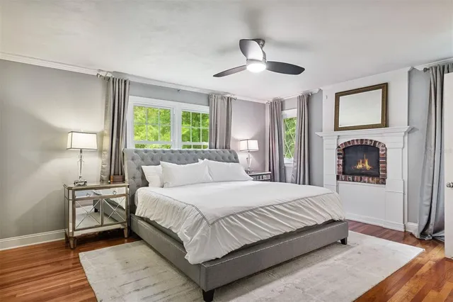 a bedroom with a large bed and a large window