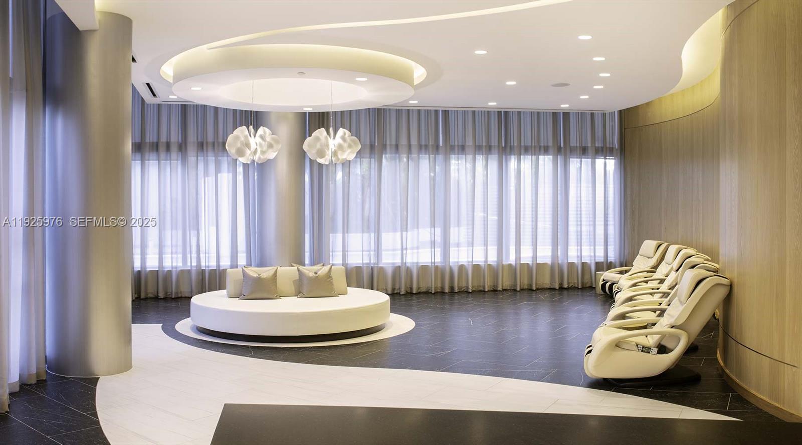 851 Northeast 1st Avenue, Unit 3810 Miami, FL 33132 - Photo 13 of 32 a living room with furniture and a chandelier