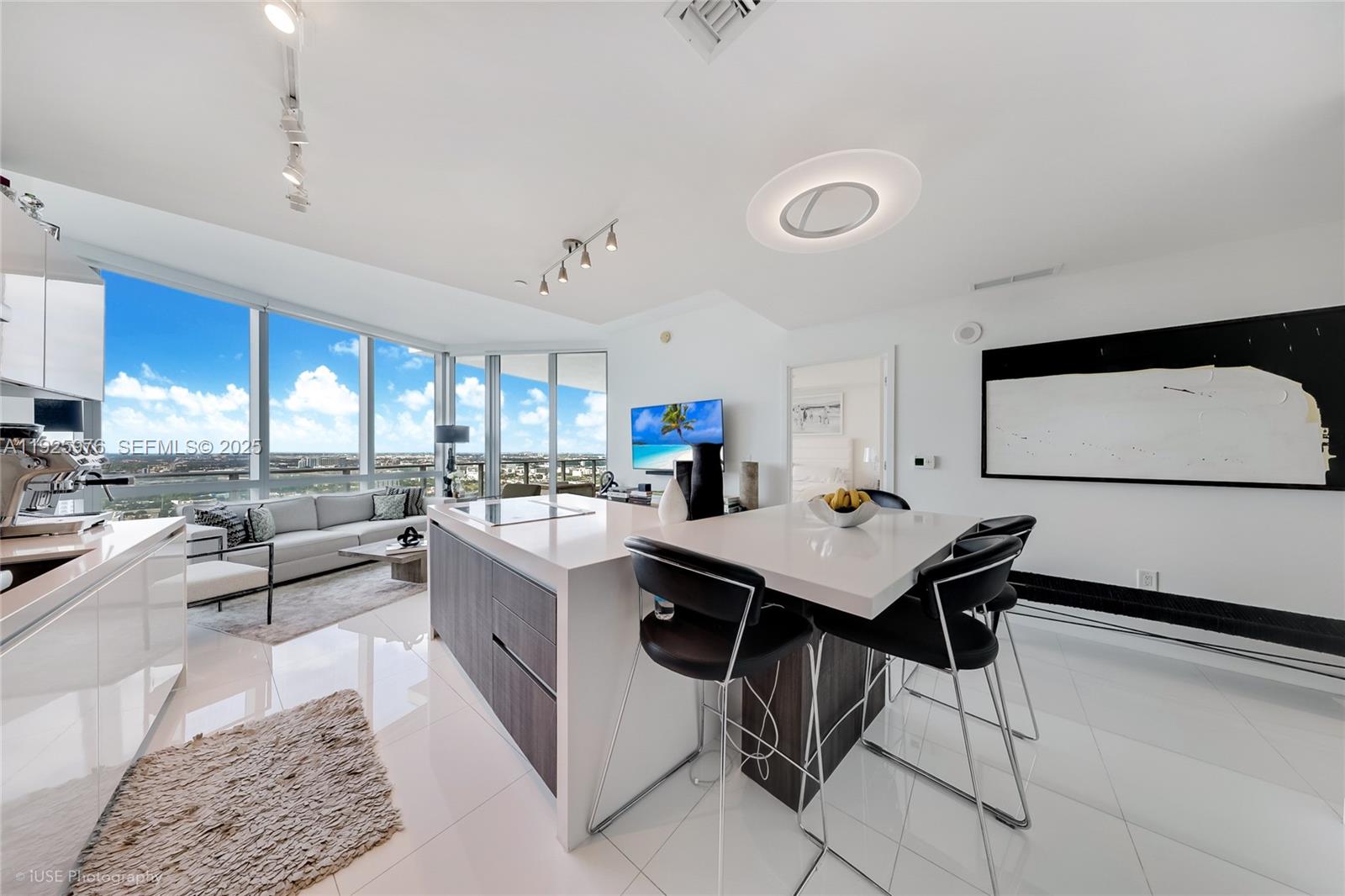 851 Northeast 1st Avenue, Unit 3810 Miami, FL 33132 - Photo 23 of 32 a living room with furniture and a large window