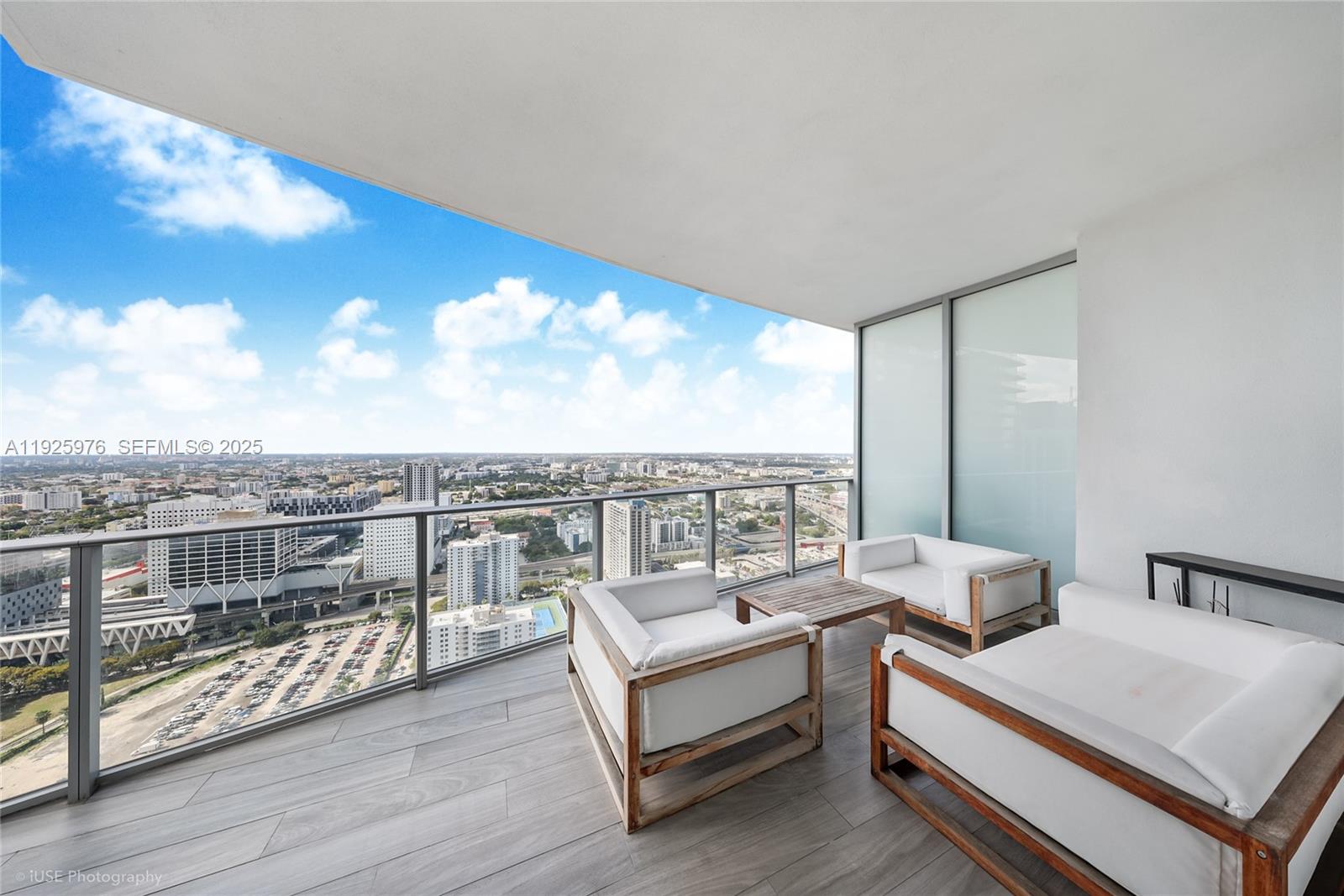 851 Northeast 1st Avenue, Unit 3810 Miami, FL 33132 - Photo 29 of 32 a view of a terrace with couches and city view