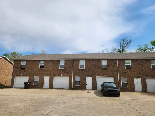 a front view of a house with parking