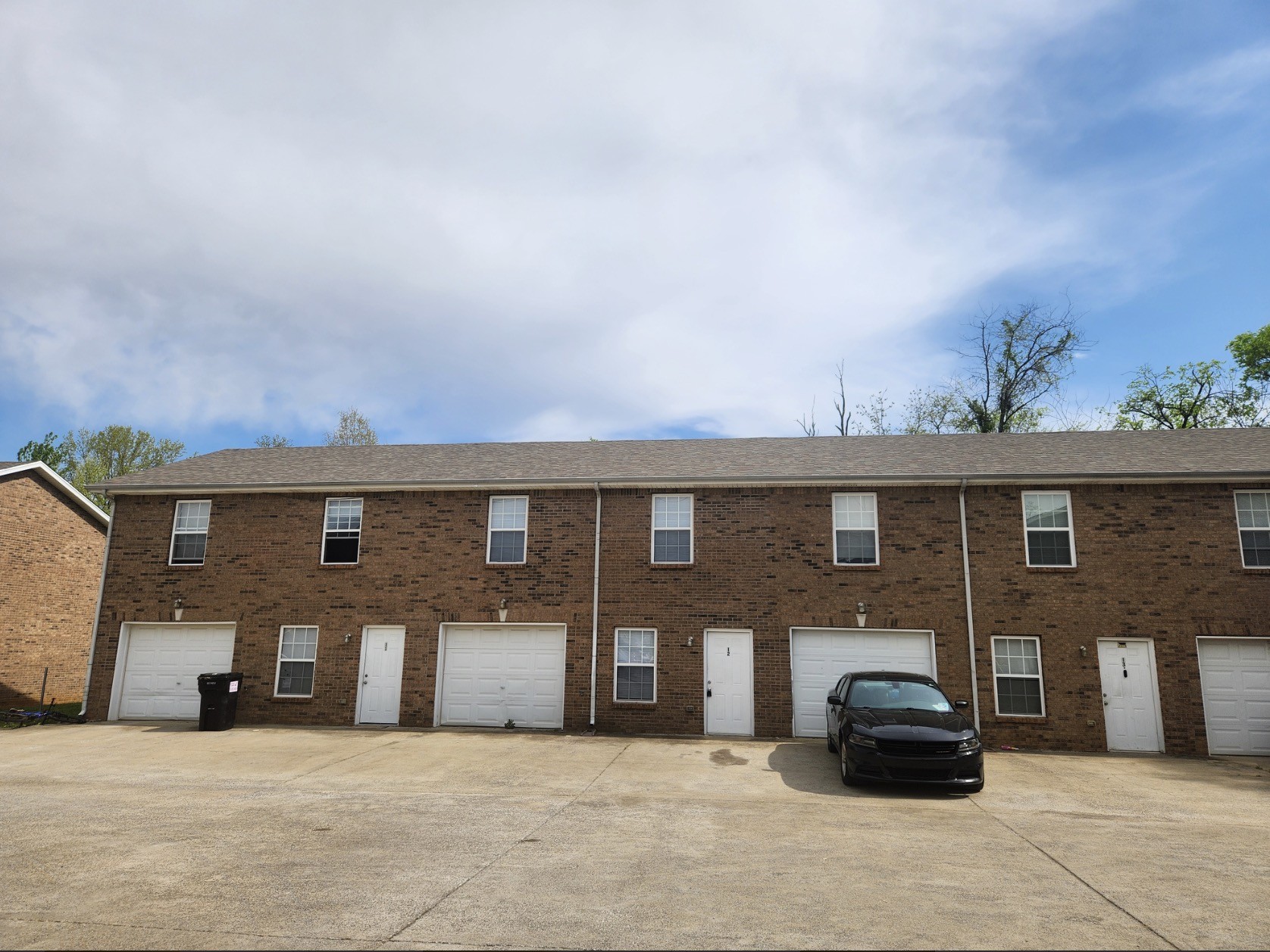 a front view of a house with parking
