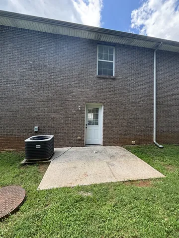 a brick house with a yard