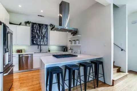 a kitchen with a table and chairs in it