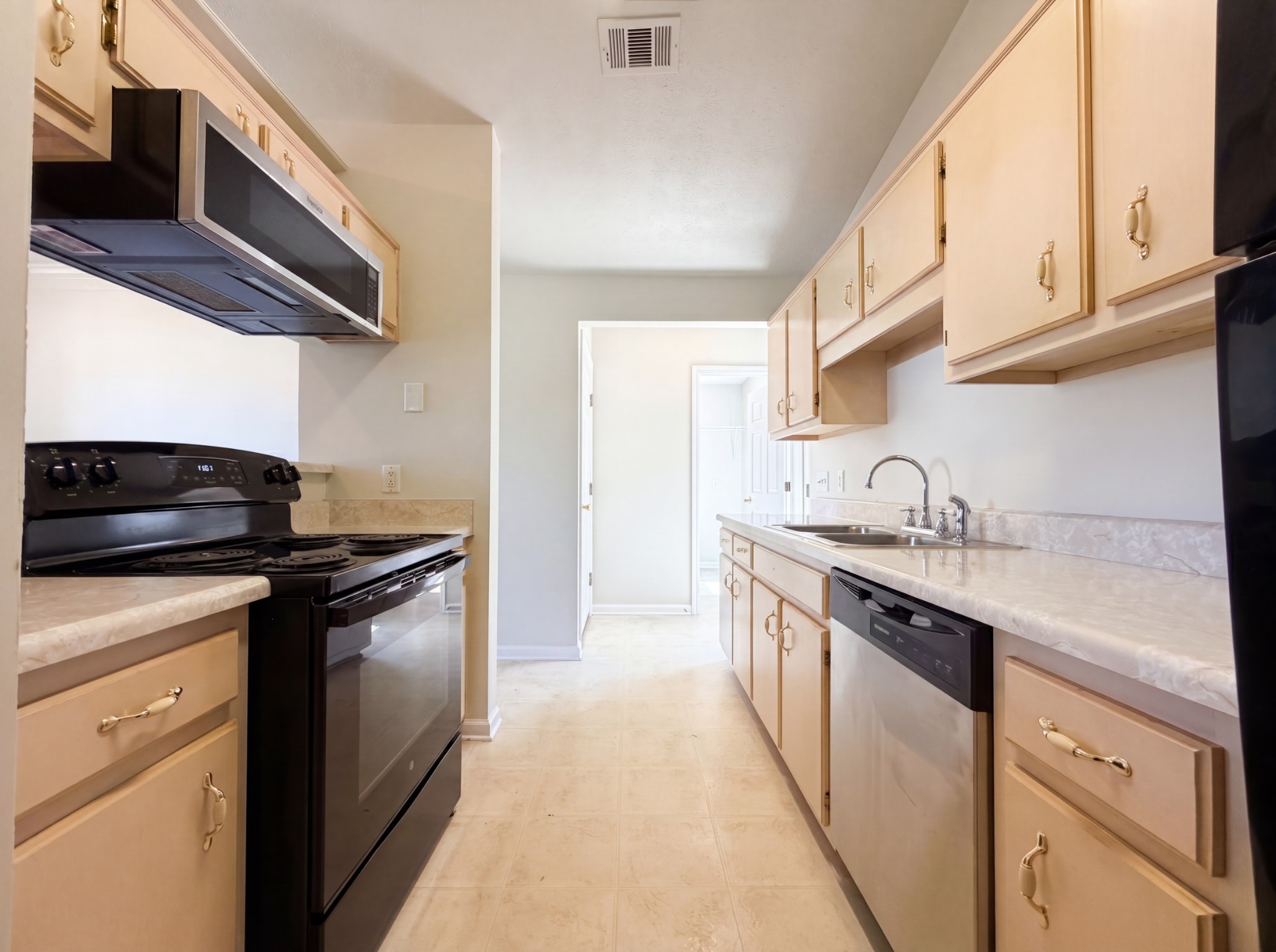 609 Sandy Spring Trail Madison, TN 37115 - Photo 2 of 16 a kitchen with stainless steel appliances granite countertop a sink and a stove