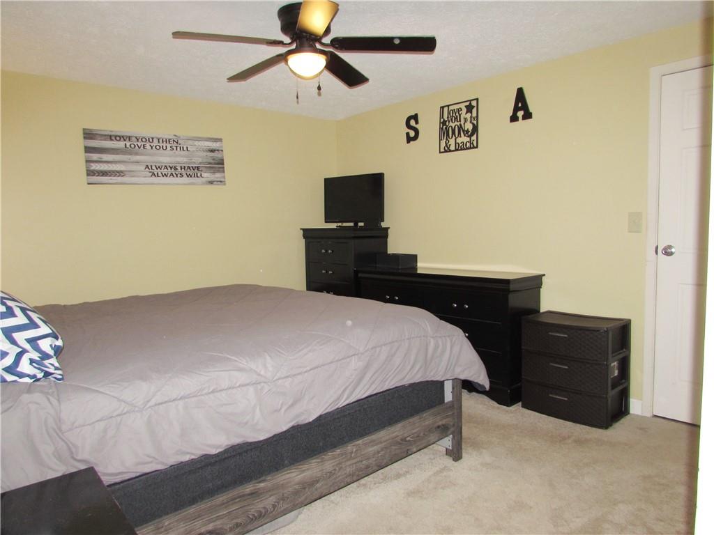 417 Rampart Boulevard New Kensington, PA 15068 - Photo 17 of 39 a bedroom with a bed and a flat screen tv