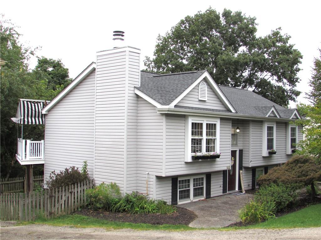 417 Rampart Boulevard New Kensington, PA 15068 - Photo 2 of 39 a front view of a house with a yard