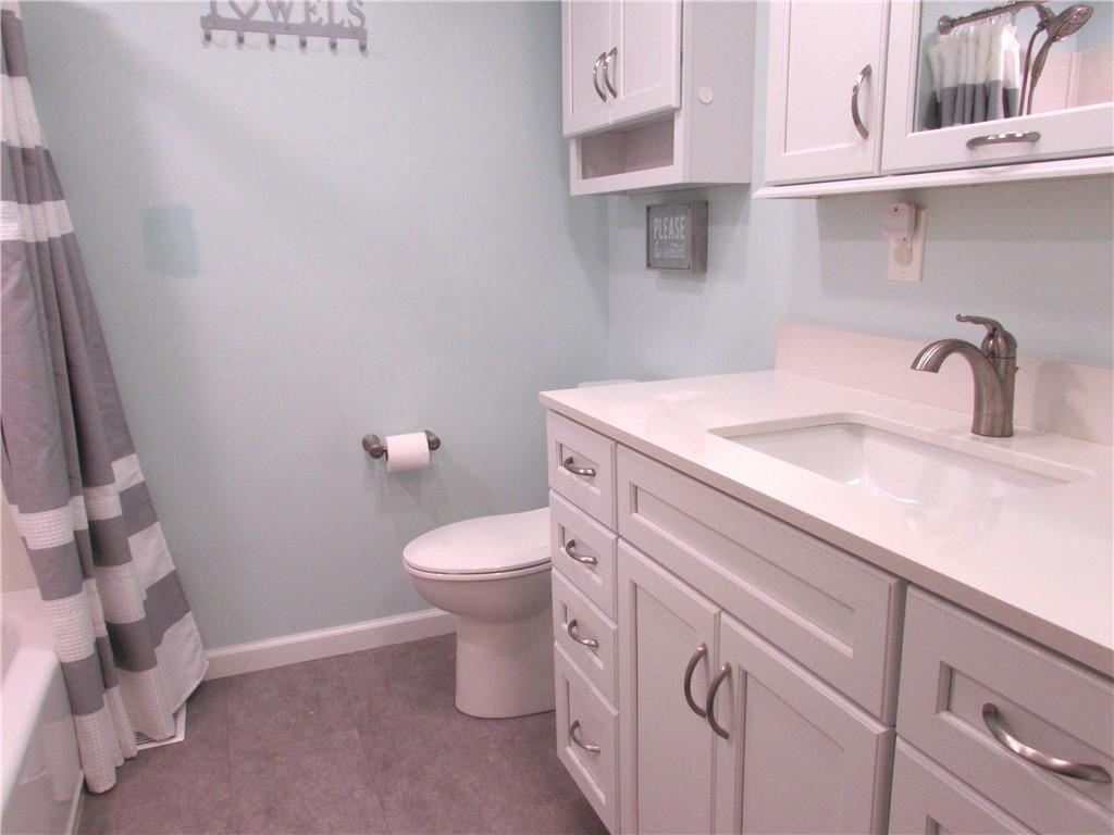 417 Rampart Boulevard New Kensington, PA 15068 - Photo 24 of 39 a bathroom with a sink a toilet and vanity