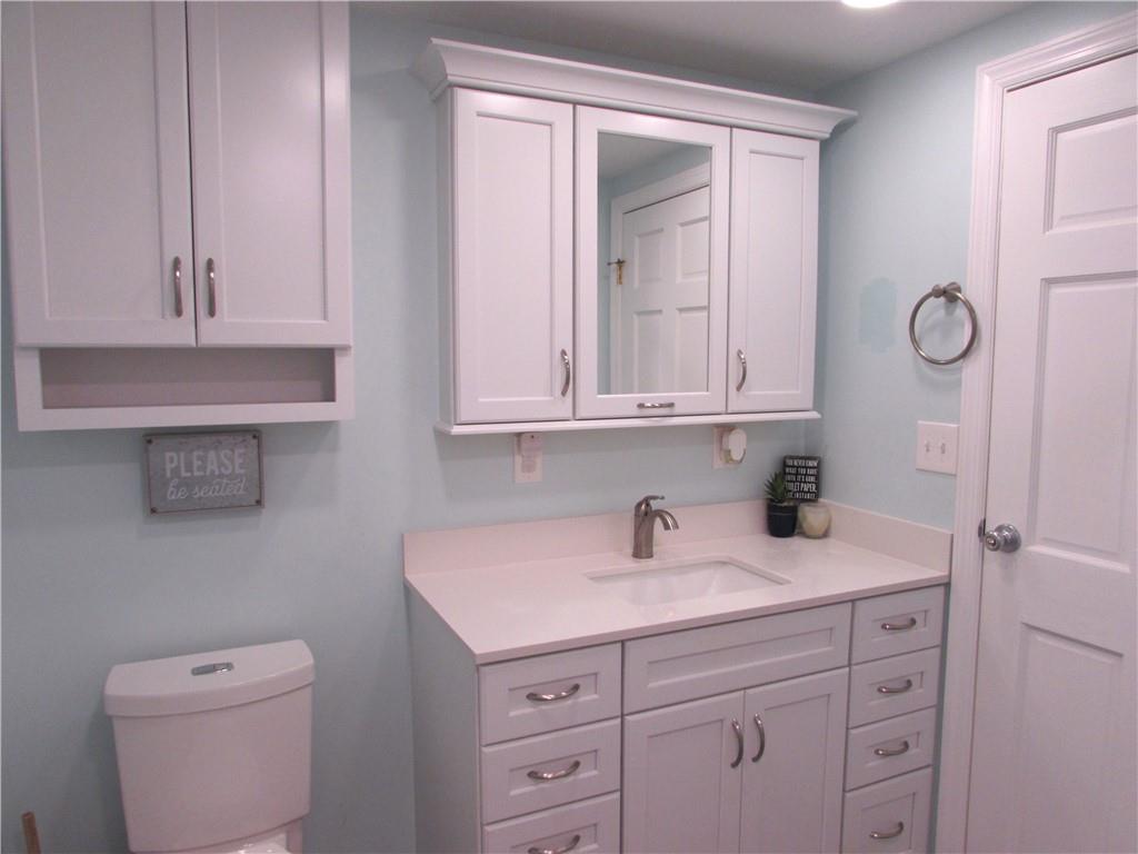 417 Rampart Boulevard New Kensington, PA 15068 - Photo 27 of 39 a bathroom with a sink toilet vanity and cabinets
