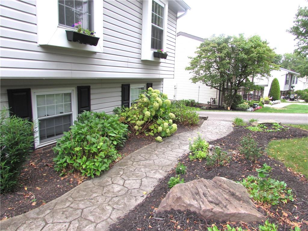 417 Rampart Boulevard New Kensington, PA 15068 - Photo 3 of 39 a front view of a house with garden