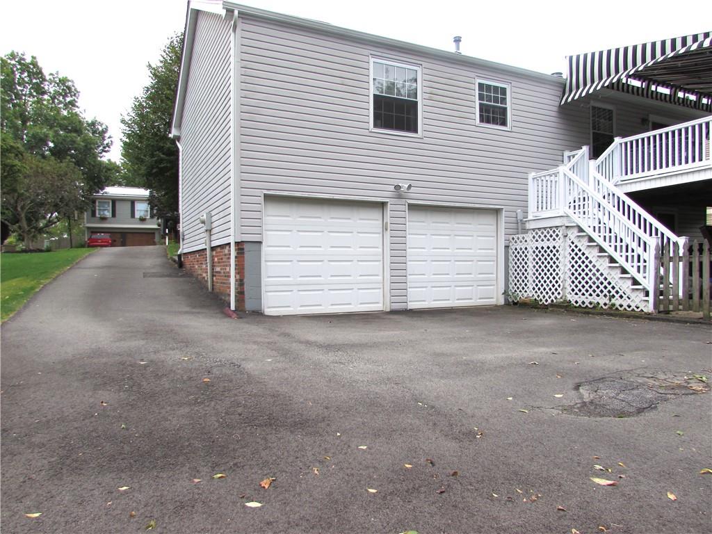 417 Rampart Boulevard New Kensington, PA 15068 - Photo 36 of 39 a view of a house with a yard and garage