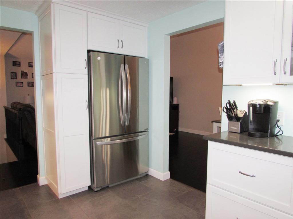 417 Rampart Boulevard New Kensington, PA 15068 - Photo 6 of 39 a kitchen with refrigerator and cabinets