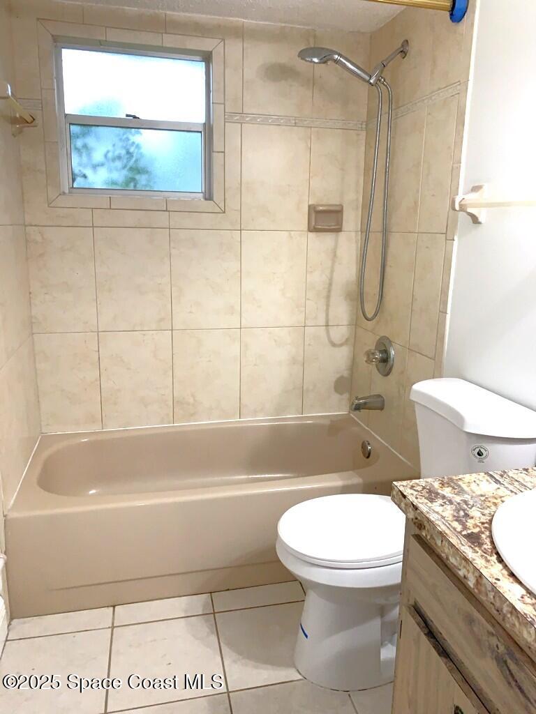 626 Fairhaven Street Northeast Palm Bay, FL 32907 - Photo 11 of 15 a bathroom with a toilet and a shower