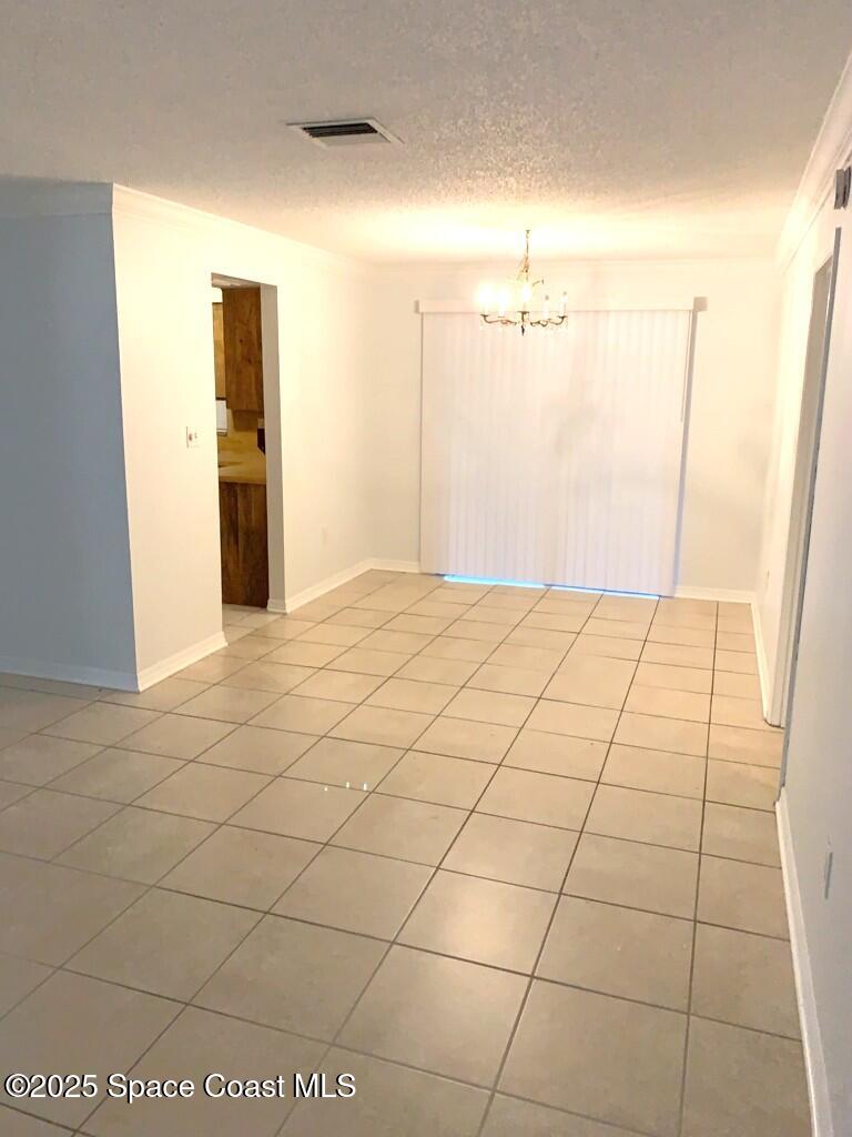 626 Fairhaven Street Northeast Palm Bay, FL 32907 - Photo 3 of 15 a view of a livingroom with an empty space and a window