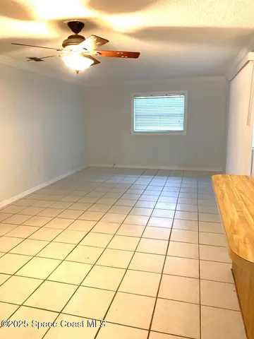 a view of an empty room and entryway