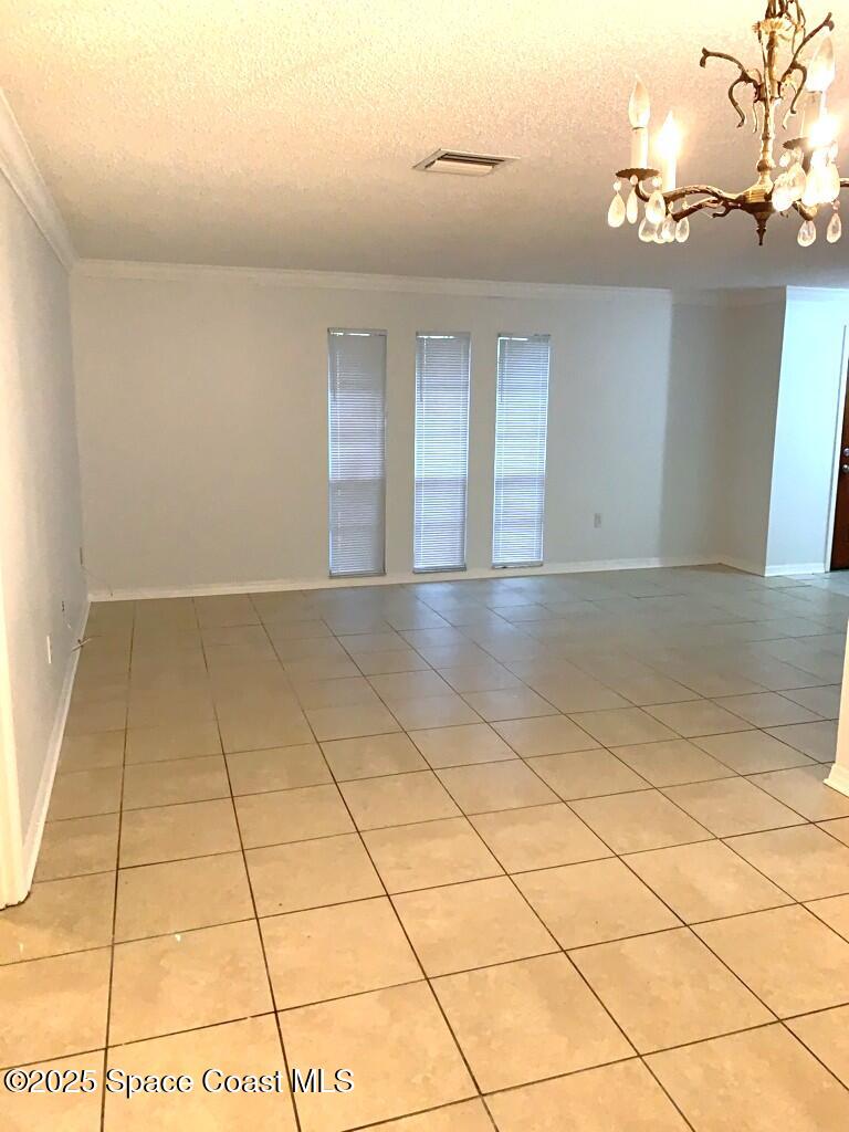 626 Fairhaven Street Northeast Palm Bay, FL 32907 - Photo 7 of 15 a view of an empty room and entryway