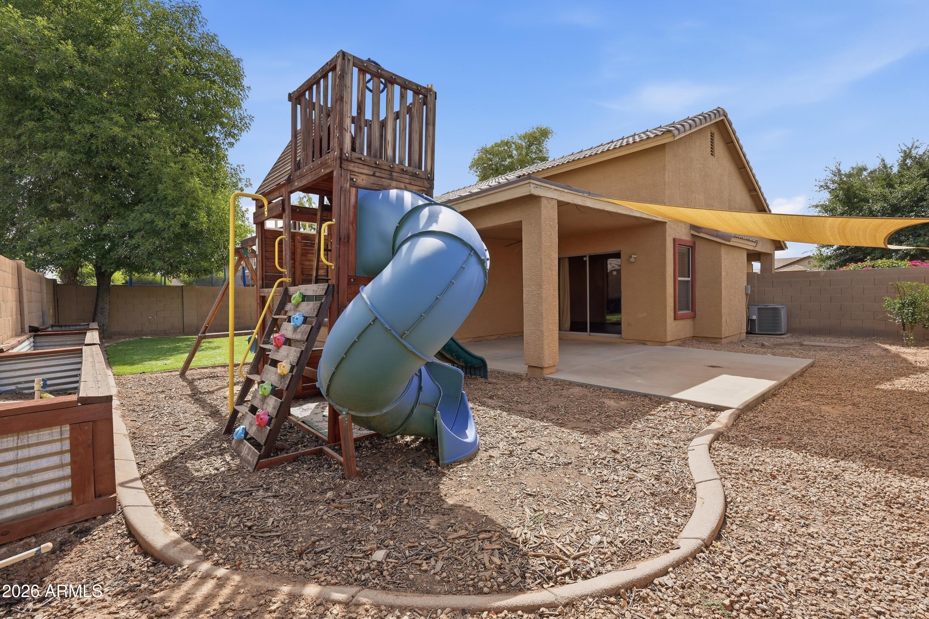 3242 East Bonanza Road Gilbert, AZ 85297 - Photo 30 of 36 a view of a house with a chairs in patio