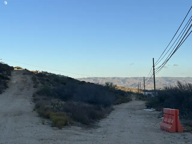 a view of a roof deck with table and chairs