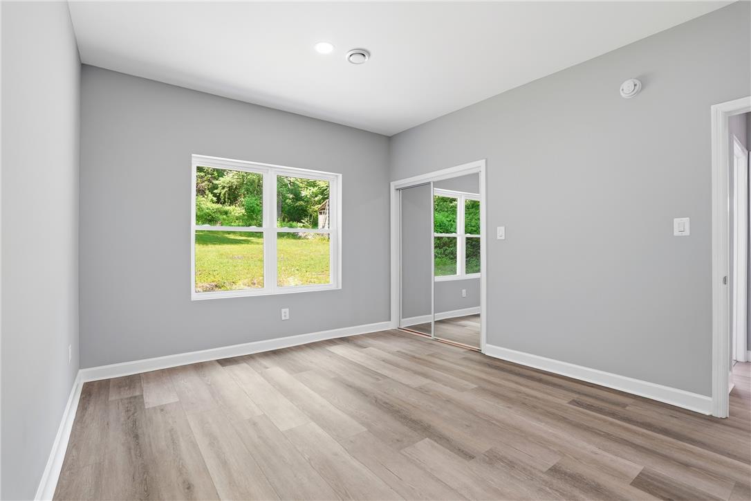 601 Fireline Road Bowmanstown, PA 18071 - Photo 13 of 21 a view of an empty room with wooden floor and a window