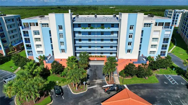 a view of building with garden space and plants