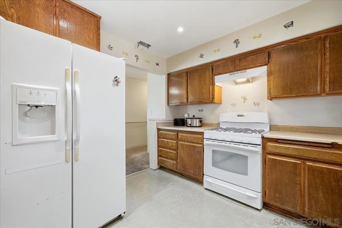 214 Summit Avenue Fallbrook, CA 92028 - Photo 11 of 43 a kitchen with cabinets stainless steel appliances and a counter space