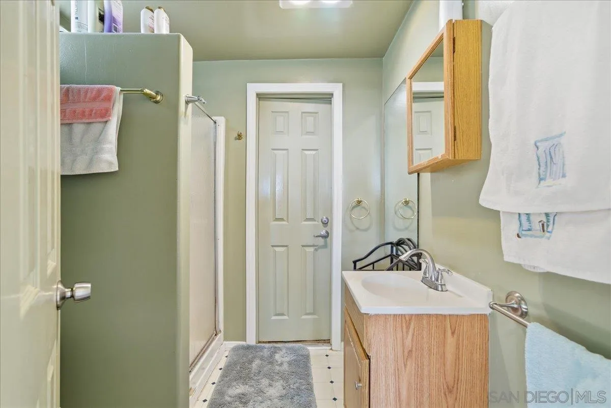 214 Summit Avenue Fallbrook, CA 92028 - Photo 24 of 43 a bathroom with a sink and a mirror