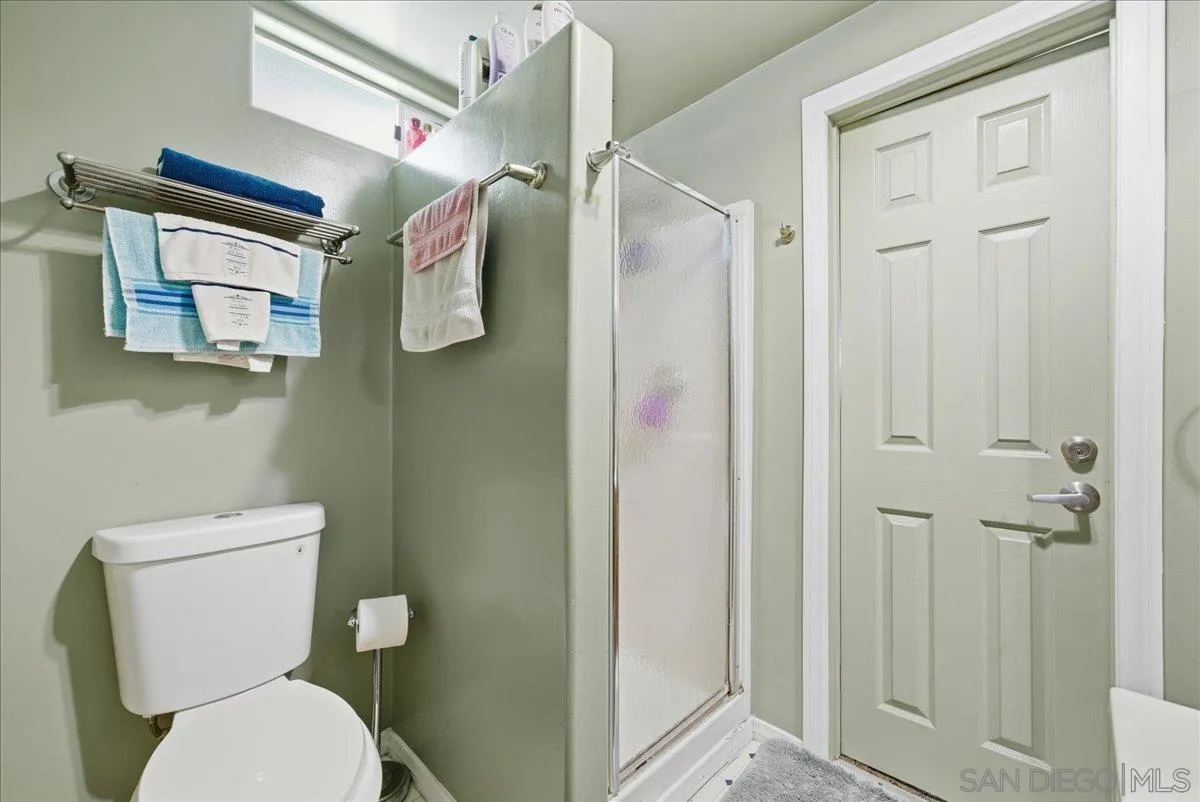214 Summit Avenue Fallbrook, CA 92028 - Photo 25 of 43 a bathroom with a toilet sink and shower