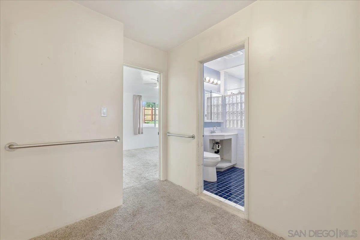 214 Summit Avenue Fallbrook, CA 92028 - Photo 28 of 43 a view of a hallway with white walls and closet