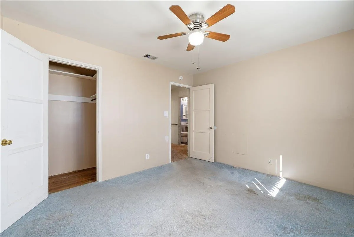 214 Summit Avenue Fallbrook, CA 92028 - Photo 30 of 43 an empty room with closet and a ceiling fan