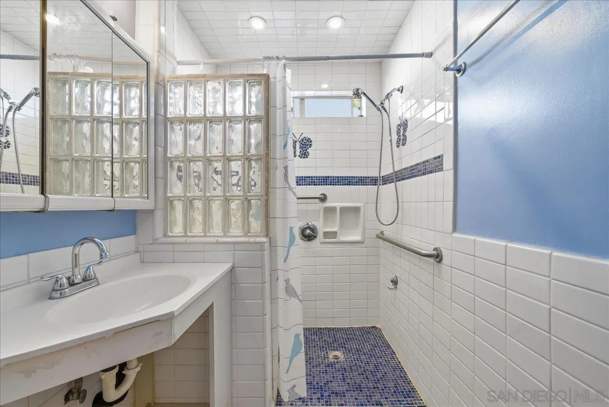 214 Summit Avenue Fallbrook, CA 92028 - Photo 37 of 43 a bathroom with a sink and a mirror