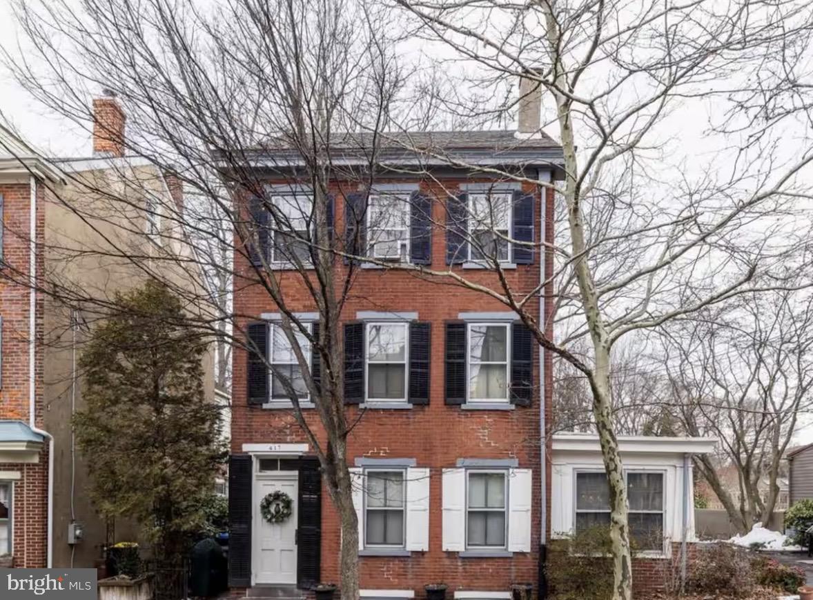 417 Delaware Street New Castle, DE 19720 - Photo 1 of 27 a front view of a house with a tree