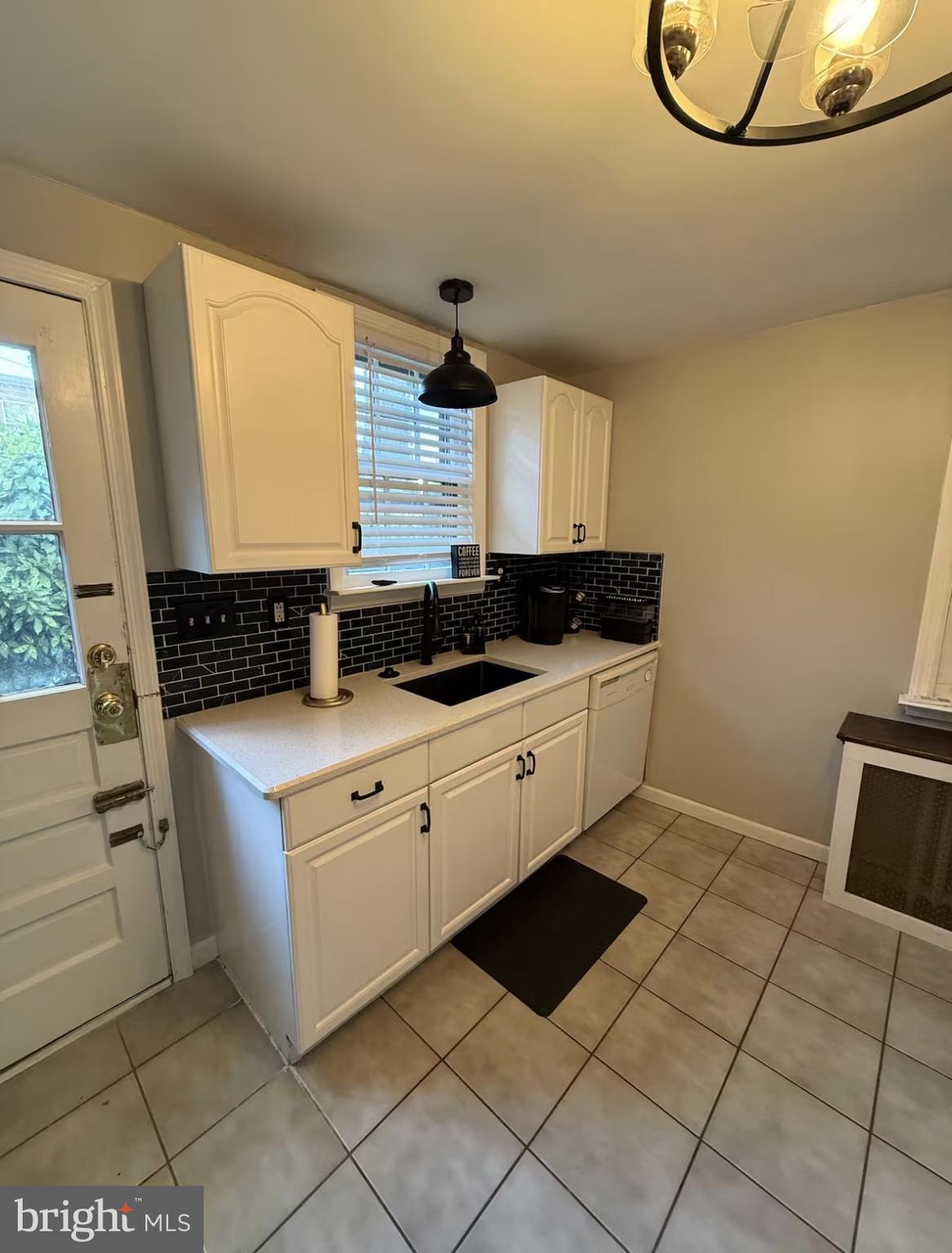 417 Delaware Street New Castle, DE 19720 - Photo 19 of 27 a kitchen with stainless steel appliances granite countertop a sink stove and cabinets