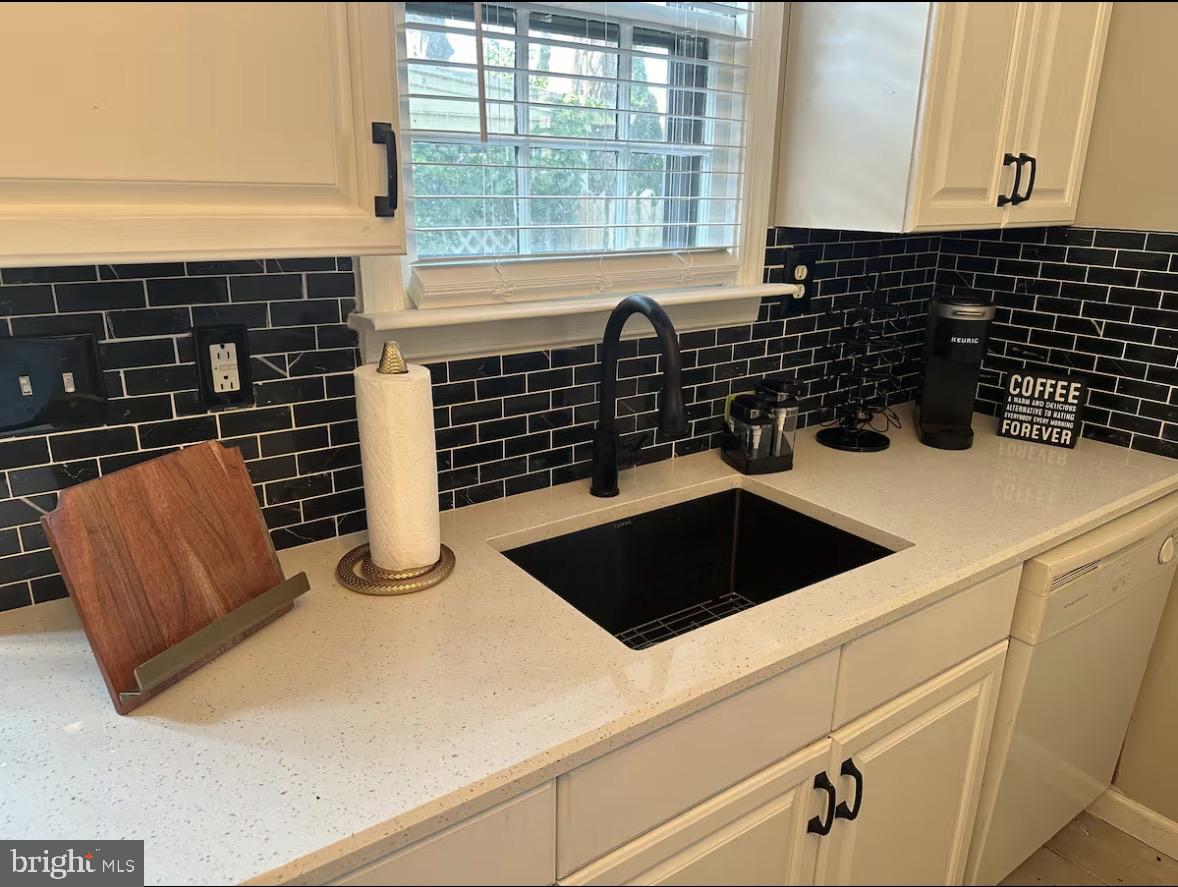 417 Delaware Street New Castle, DE 19720 - Photo 20 of 27 a kitchen with a sink and a stove top oven