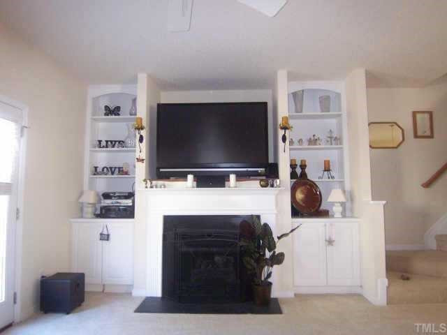 2020 Metacomet Way Raleigh, NC 27604 - Photo 9 of 12 Spacious Entertainment Area in Living Room with Shelving and Cabinets. Will take a 60' TV! Living Room