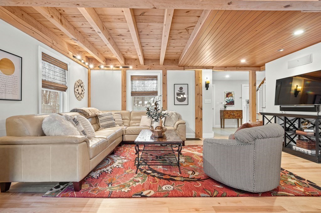 10 Grapevine Road Wenham, MA 01984 - Photo 3 of 42 a living room with furniture and a flat screen tv