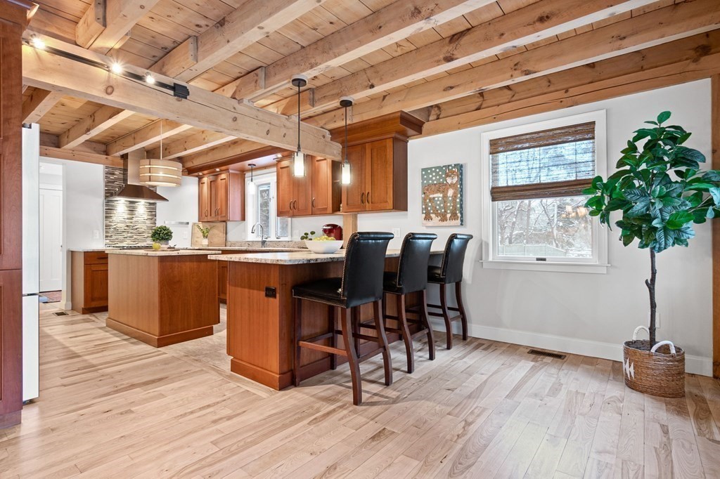10 Grapevine Road Wenham, MA 01984 - Photo 5 of 42 a view of a dining room with furniture window and wooden floor