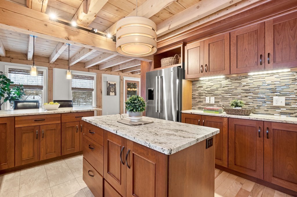 10 Grapevine Road Wenham, MA 01984 - Photo 8 of 42 a kitchen with stainless steel appliances granite countertop a sink and cabinets