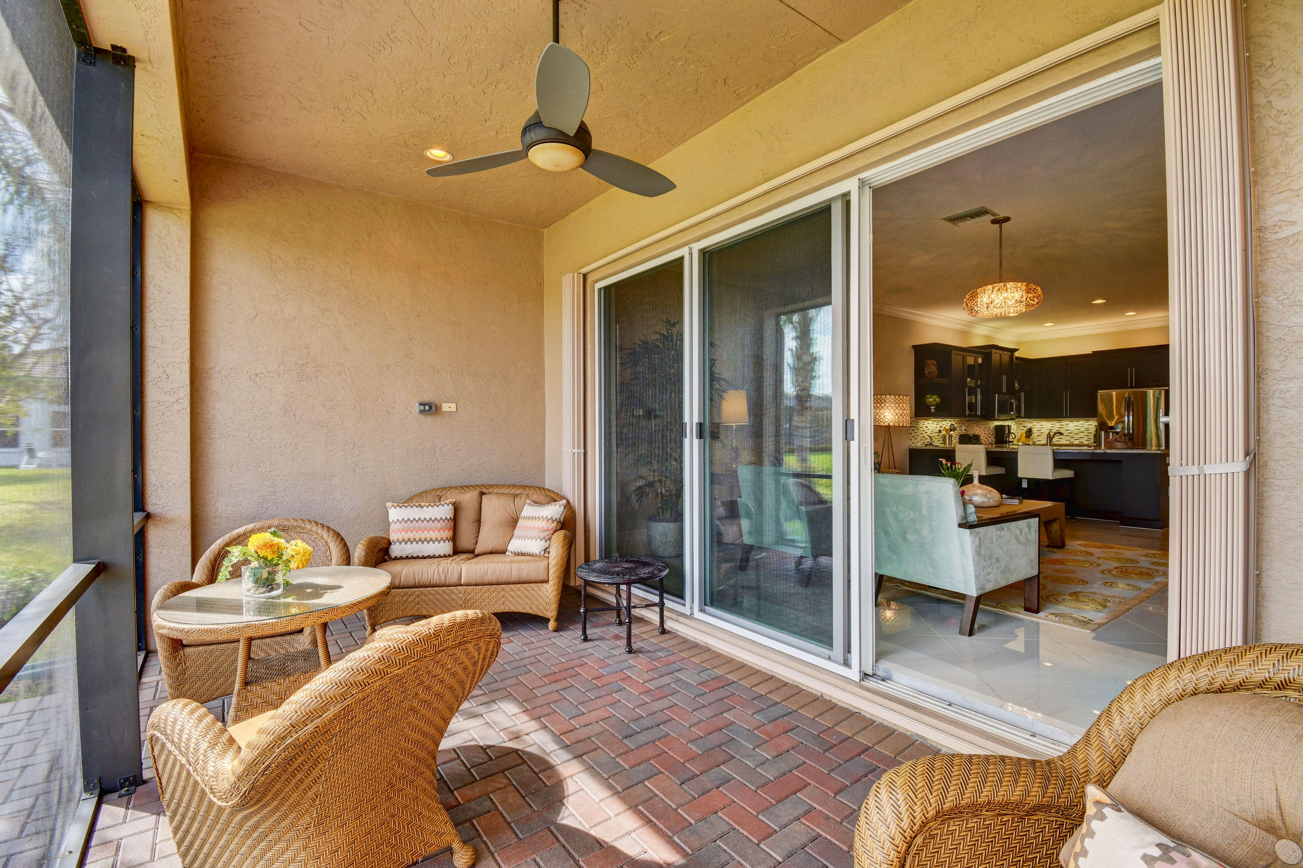 9109 Clearhill Road Boynton Beach, FL 33473 - Photo 24 of 38 pATIO WITH DOOR OPEN