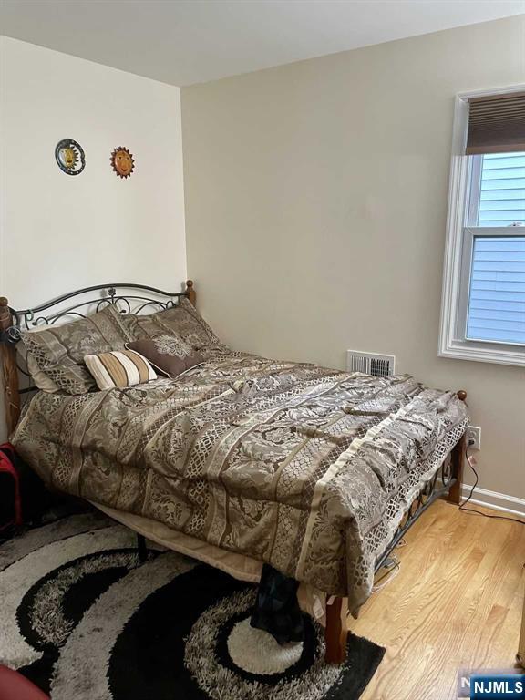 13 Jersey Avenue Mahwah, NJ 07430 - Photo 11 of 20 a bedroom with a bed and a window