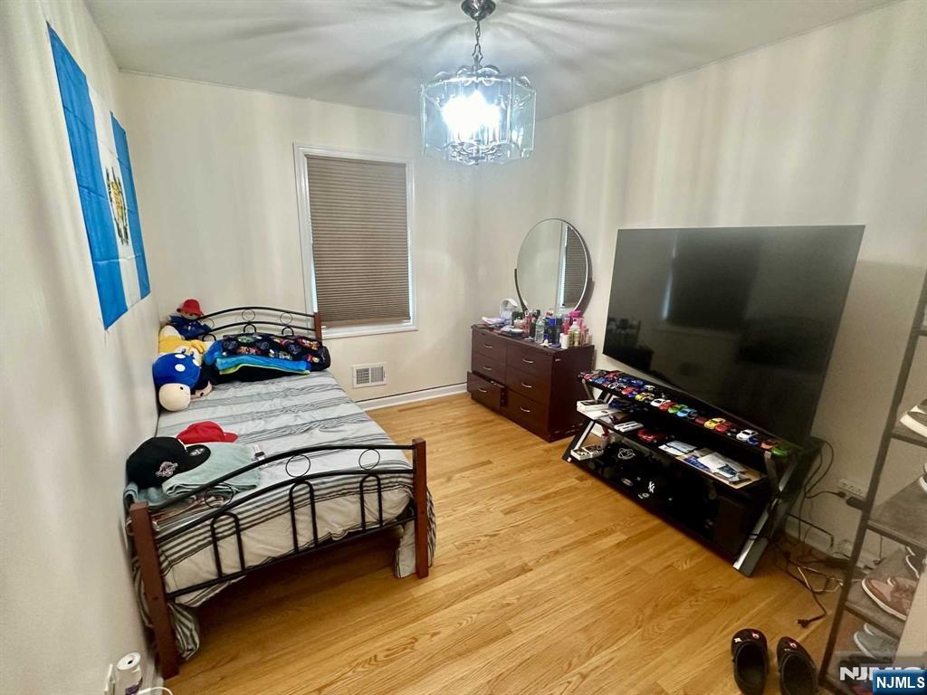 13 Jersey Avenue Mahwah, NJ 07430 - Photo 12 of 20 a living room with furniture and a flat screen tv