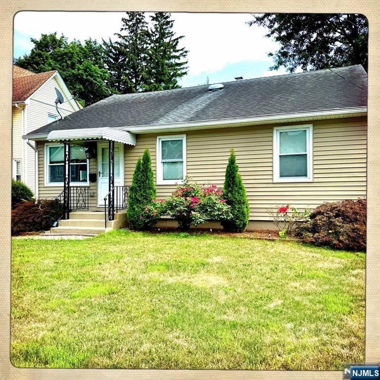 13 Jersey Avenue Mahwah, NJ 07430 - Photo 20 of 20 a view of a house with backyard and sitting area