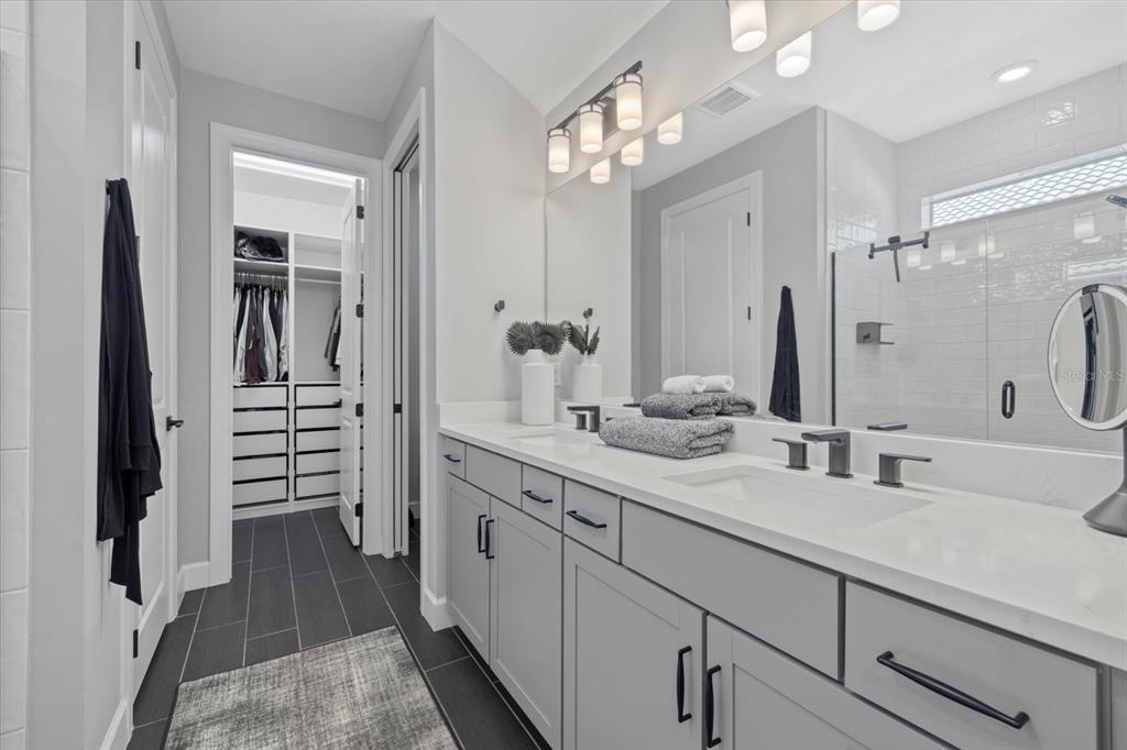 3508 Anchor Bay Trail Lakewood Ranch, FL 34211 - Photo 23 of 74 a bathroom with a double vanity sink a vanity and a mirror