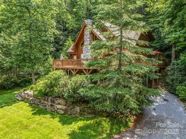 a aerial view of a house with a yard