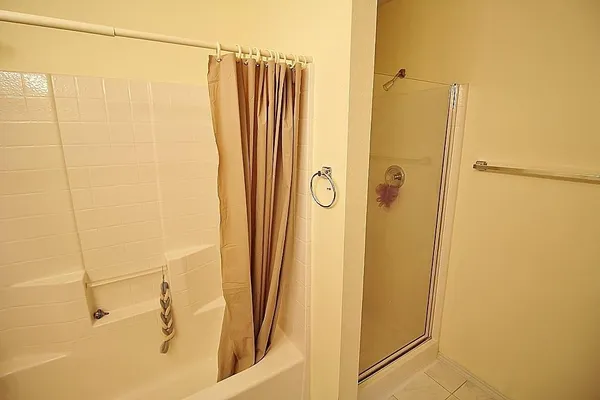 a bathroom with a shower and a shower
