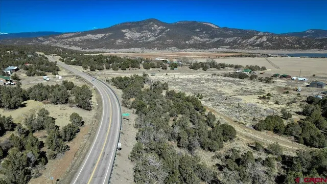 a view of a mountain with a mountain in the background