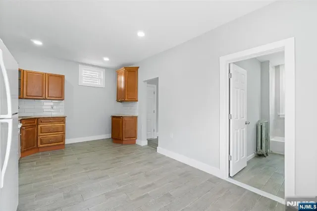 a view of an empty room and fire place