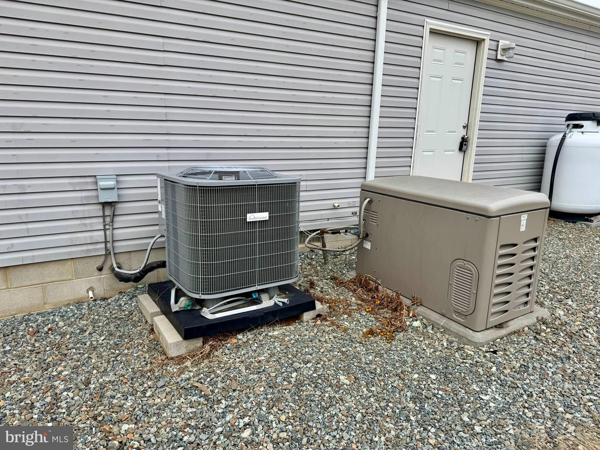 38 Groff Farm Road Conowingo, MD 21918 - Photo 24 of 30 a view of a backyard with a chair and the potted plant